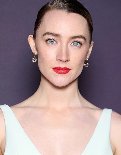 Saoirse Ronan's elegant bun at the BAFTAs perfectly complemented her timeless red lipstick.