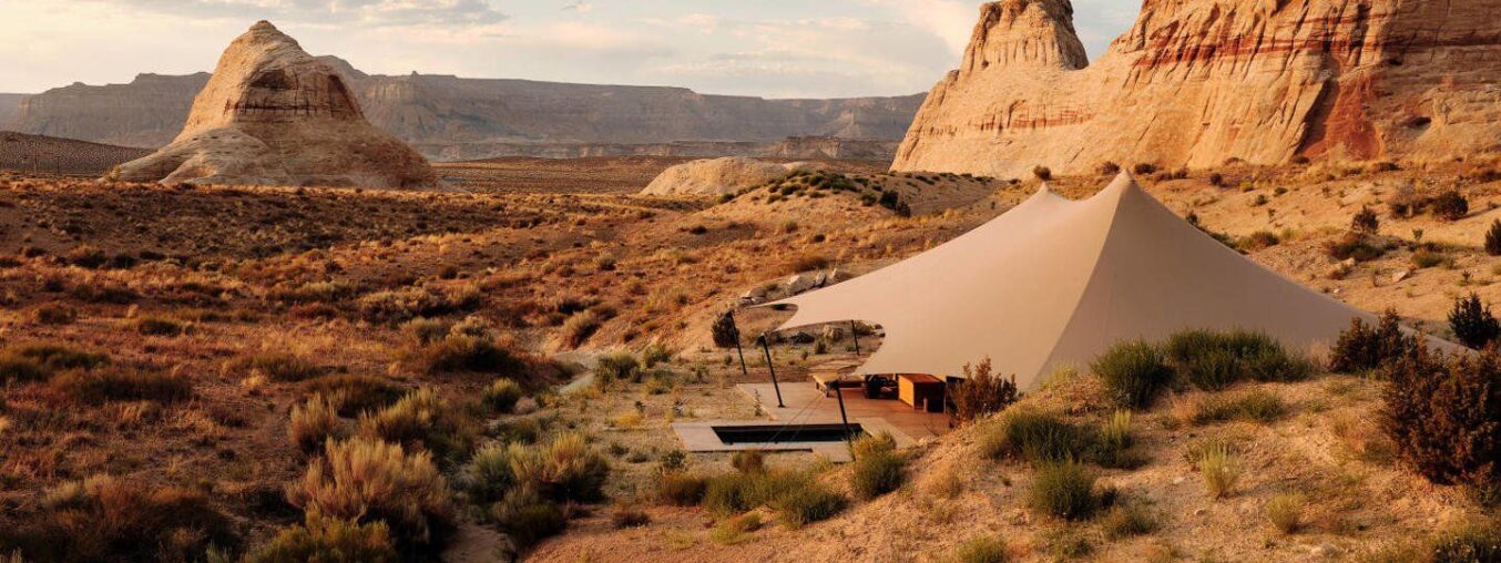 Here are 23 of the best glamping resorts across the United States. These destinations offer luxurious camping experiences with comfortable amenities while keeping you close to nature. From safari tents to treehouses and cozy cabins