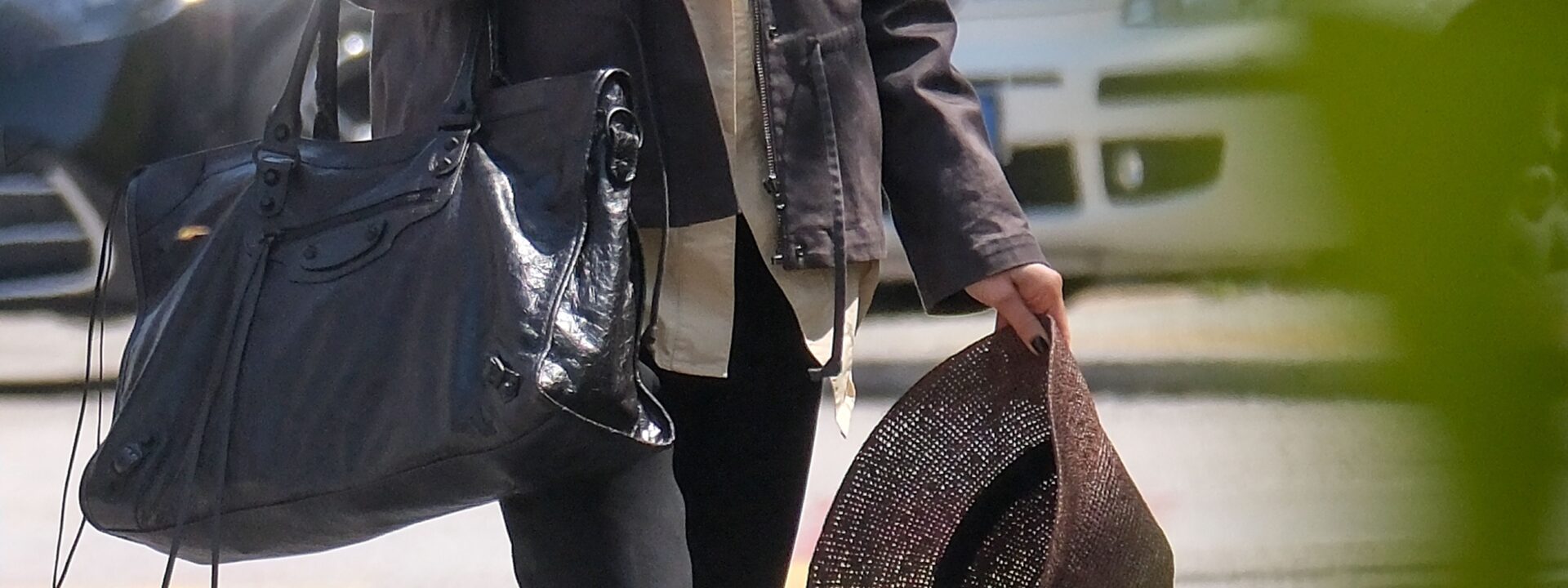 Lily Collins swaps her suitcase for a massive Balenciaga City Bag