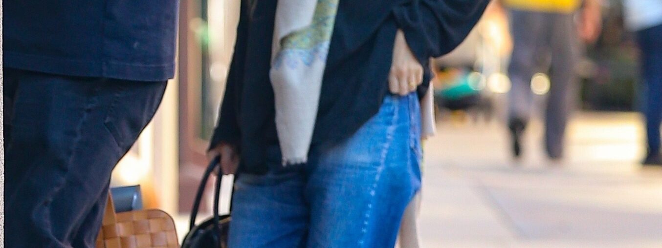 Ashley Olsen says it's never too hot to wear a scarf.