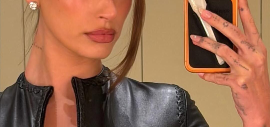 Hailey Bieber puts a cheetah print spin on the classic French manicure.