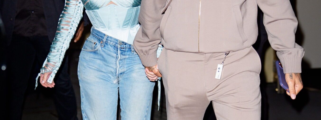 Kim Kardashian and Lewis Hamilton have different ideas about what to wear for a casual date night.