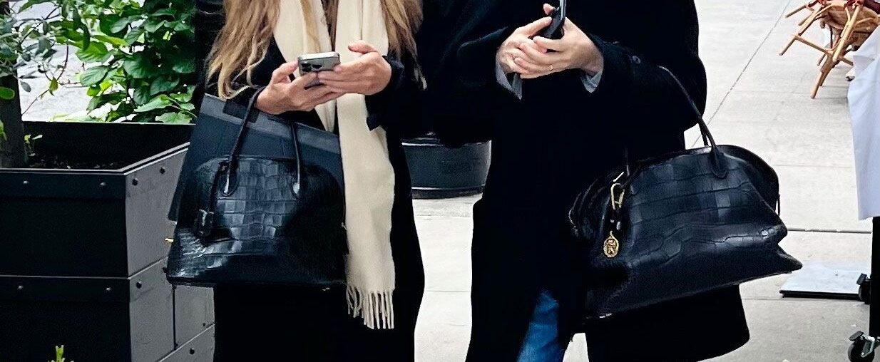 Ashley and Mary-Kate Olsen are twins, and their handbags are twins too.