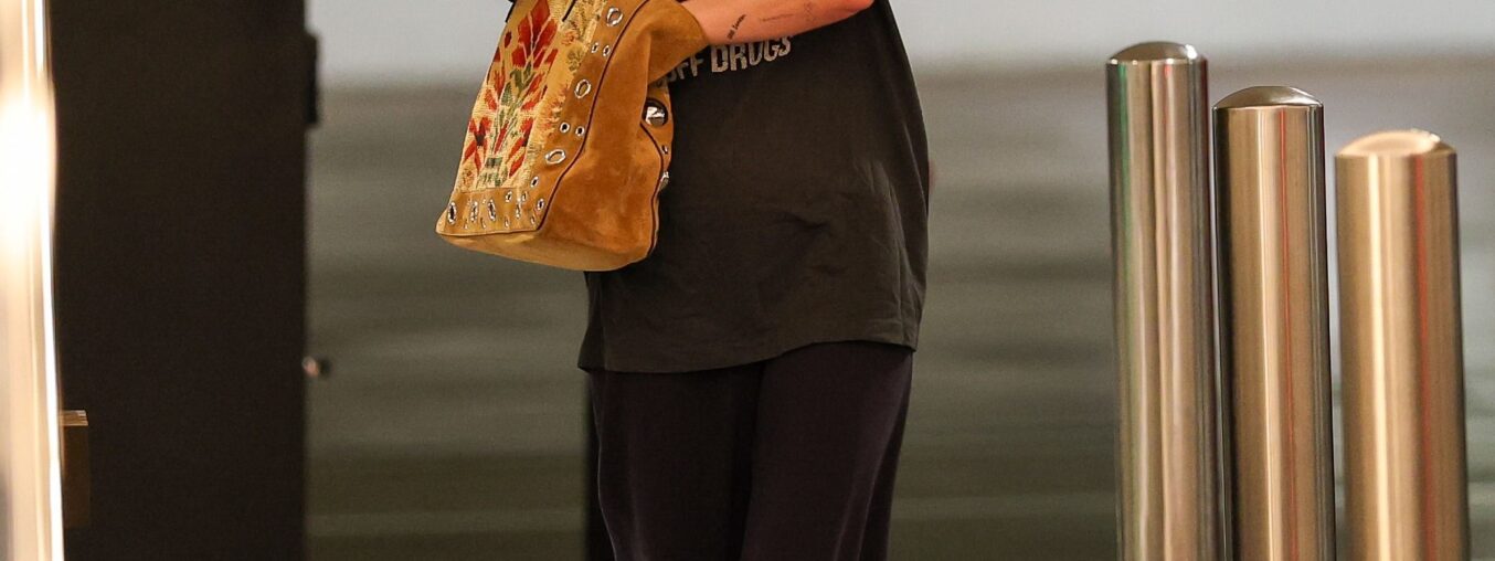 Dakota Johnson recycles a beloved slogan tee for a fresh chapter.