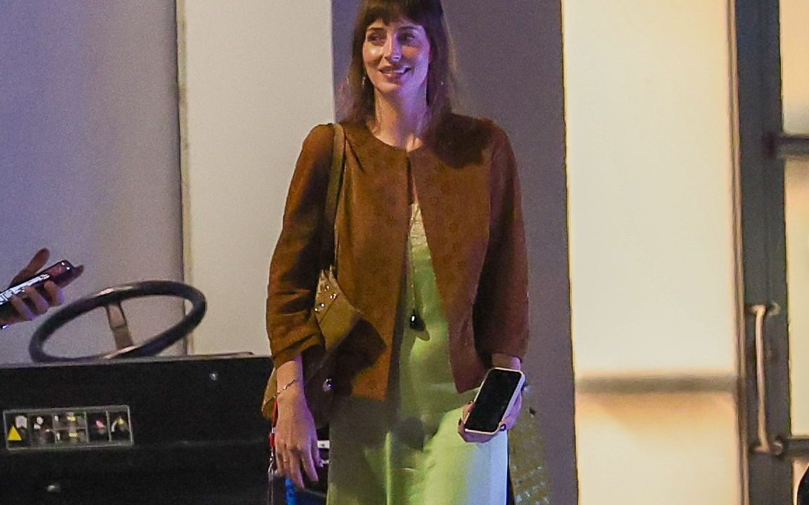 Dakota Johnson is leaning into the trendiest color right now—and pairing it with an unexpectedly bold jewelry pick.