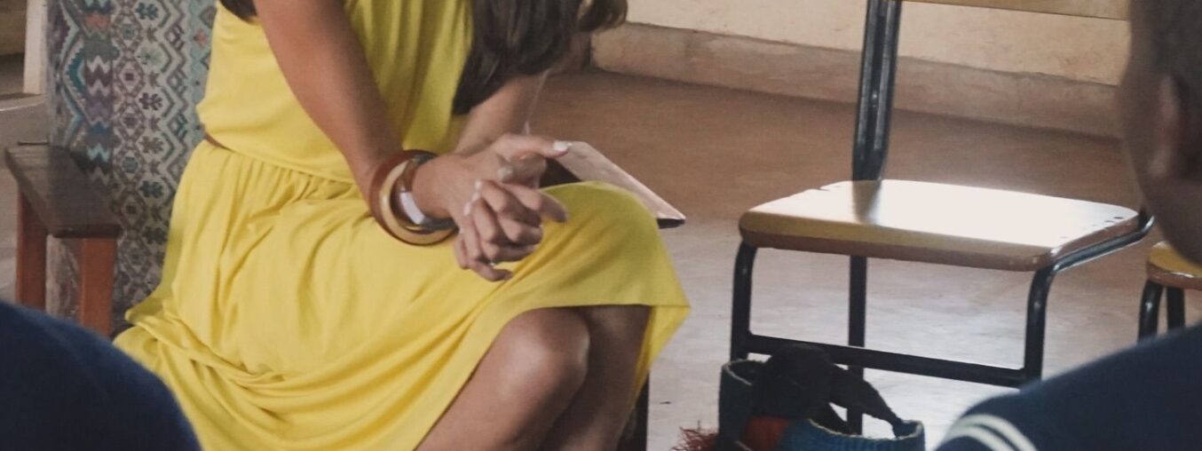 Amal Clooney brings her suits and summer dresses to Malawi.