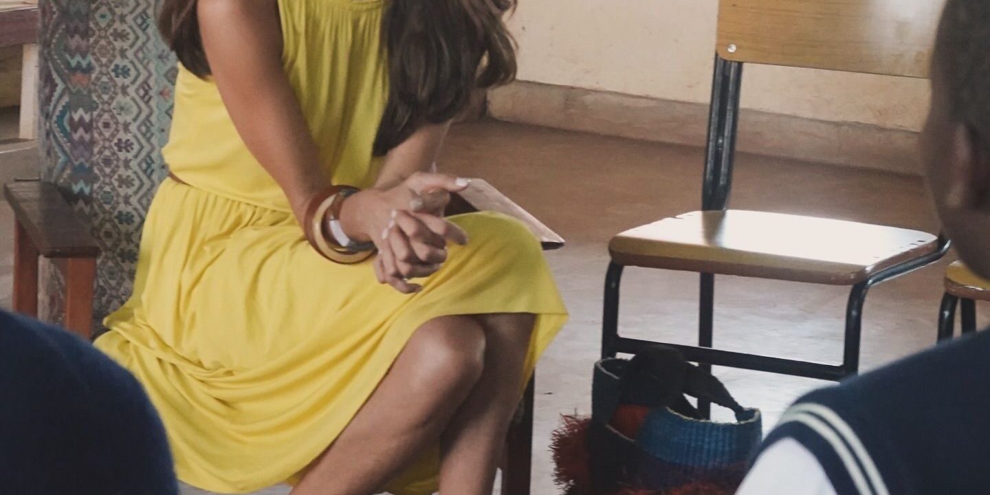 Amal Clooney brings her suits and summer dresses to Malawi.