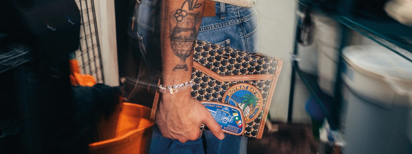 Bad Bunny's stylists designed travel bags, modeled by Benito himself.
