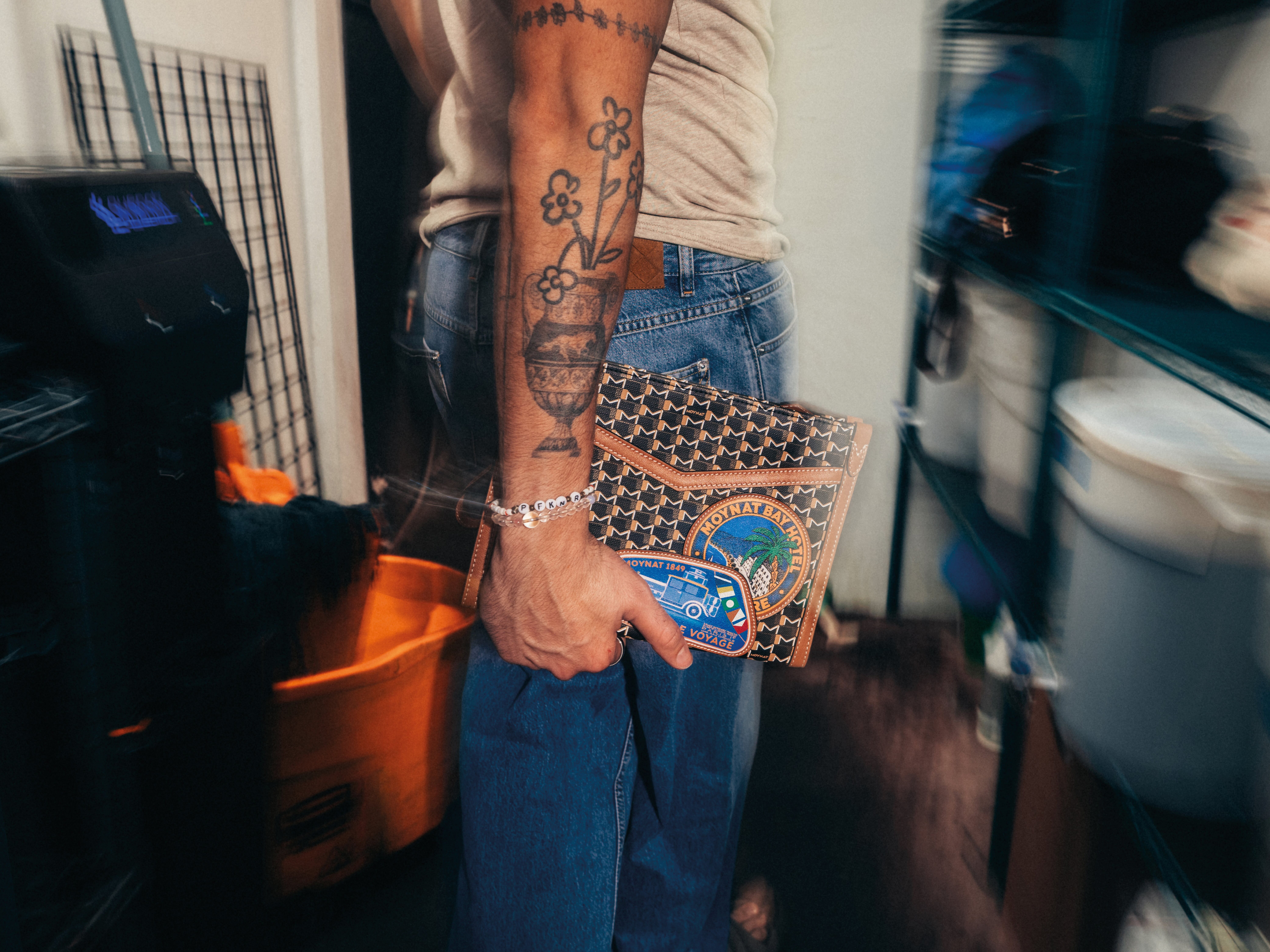 Bad Bunny's stylists designed travel bags, modeled by Benito himself.